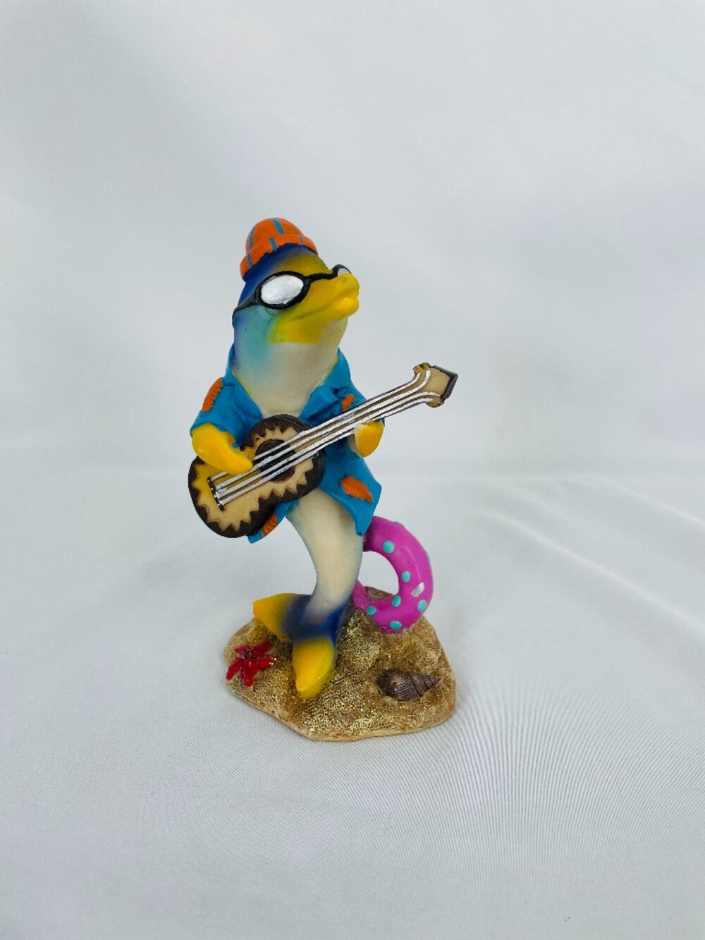 Dolphin playing guitar figurine with hat and glasses